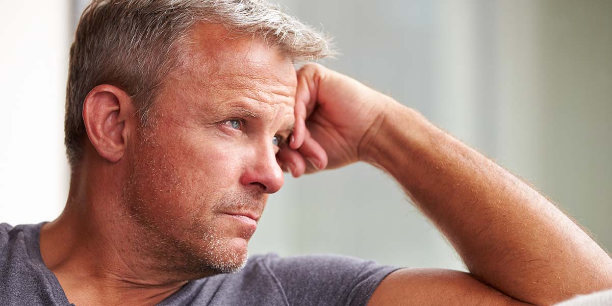 Man thinking, dealing with stress of unwanted divorce