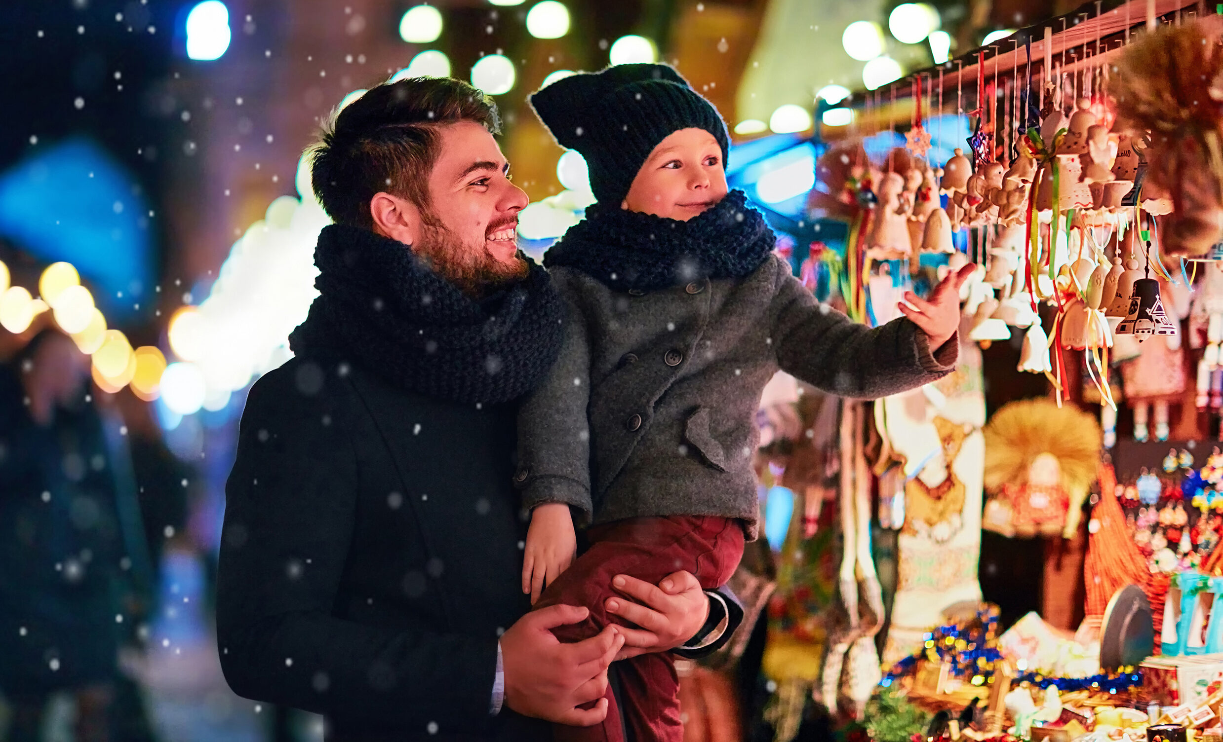 father and son spend the holiday season at a market